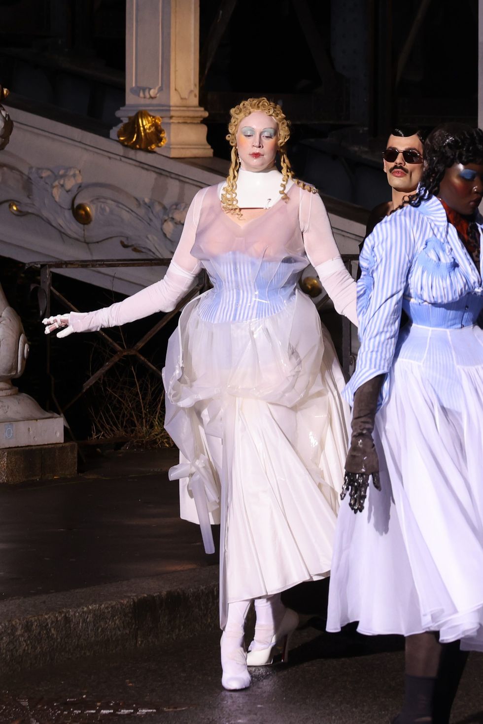 The actress took to the runway in a corseted, rubber-accented dress in Paris