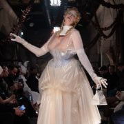 Perhaps the most show-stopping moment of all, however, was the appearance of the actress Gwendoline Christie, who took to the runway to close the show in a sheer, corseted gown overlaid with tinted rubber that wouldn't have looked out of place in a Tim Burton film. The look was accessorised with white stockings, heels and bag, as well as doll-like make-up with a gothic slant: think exaggerated blonde curls, glassy skin and smudged eyeshadow.