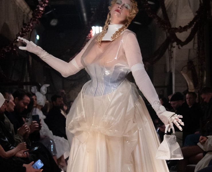 Perhaps the most show-stopping moment of all, however, was the appearance of the actress Gwendoline Christie, who took to the runway to close the show in a sheer, corseted gown overlaid with tinted rubber that wouldn't have looked out of place in a Tim Burton film. The look was accessorised with white stockings, heels and bag, as well as doll-like make-up with a gothic slant: think exaggerated blonde curls, glassy skin and smudged eyeshadow.